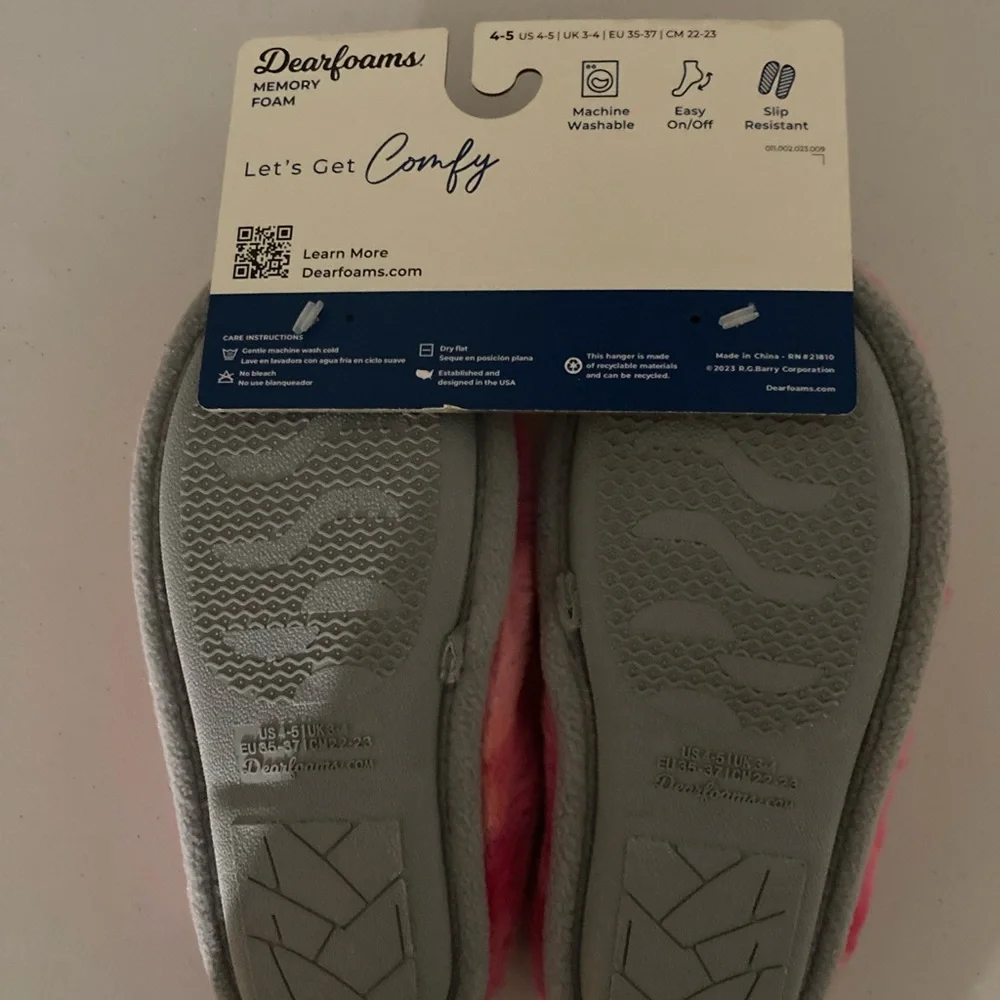 Pink fuzzy unicorn slippers by Dearfoams
